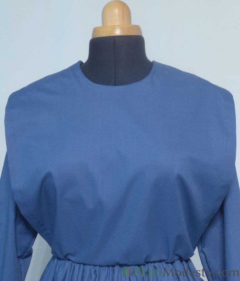 Cape Dress Front View Front view of a cape dress with a Wide, Straight, Slightly Gathered cape