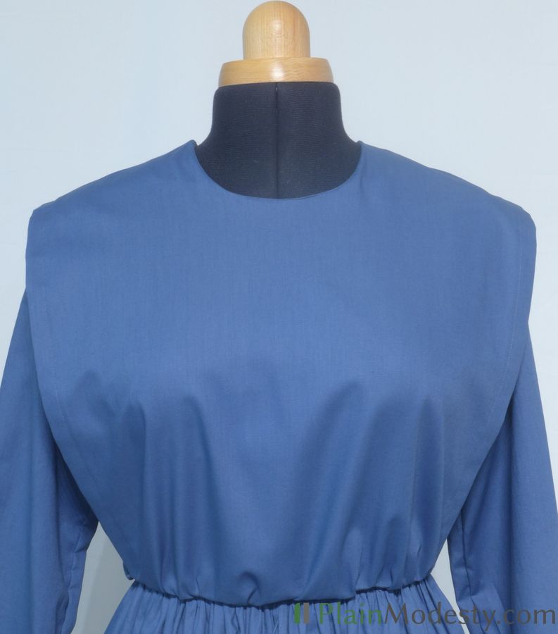 Cape Dress Front View Front view of a cape dress with a Wide, Straight, Gathered, Tapered cape