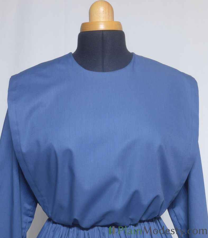 Cape Dress Front View Front view of a cape dress with a Wide, Straight, Loose, Gathered, Tapered cape