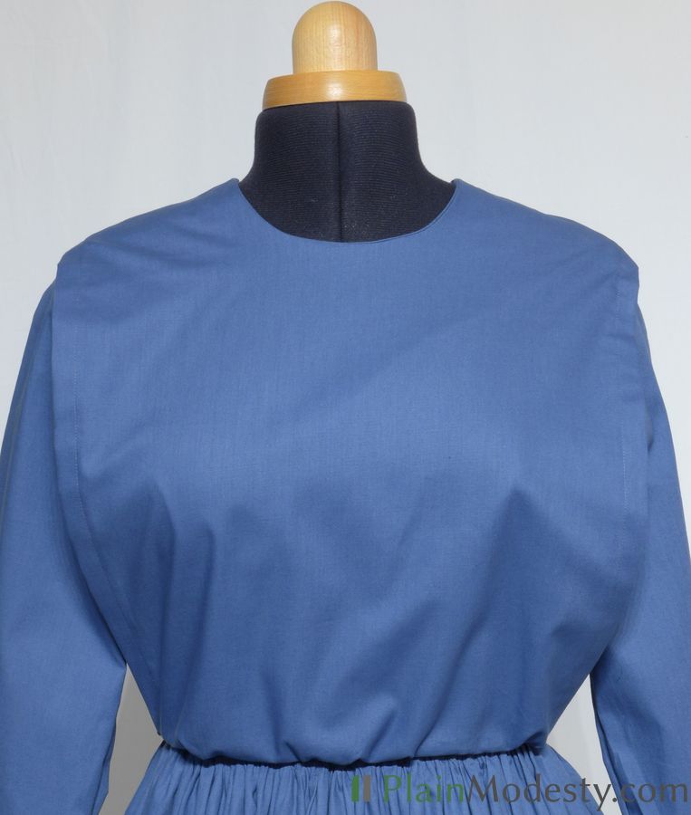 Cape Dress Front View Front view of a cape dress with a Narrow, Straight cape