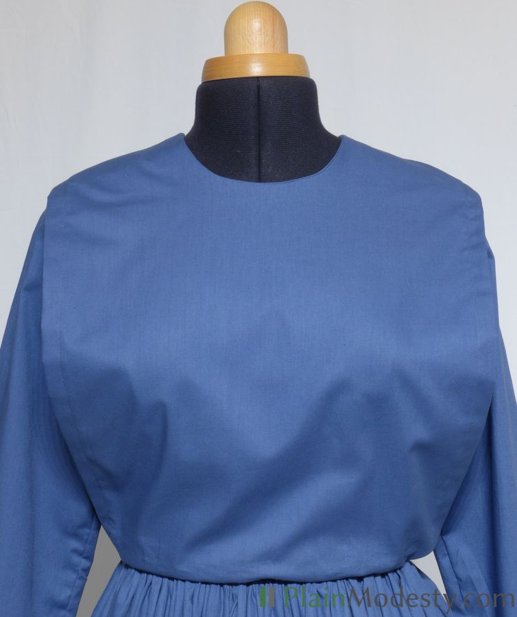 Cape Dress Front View Front view of a cape dress with a Narrow, Straight, Gaping cape