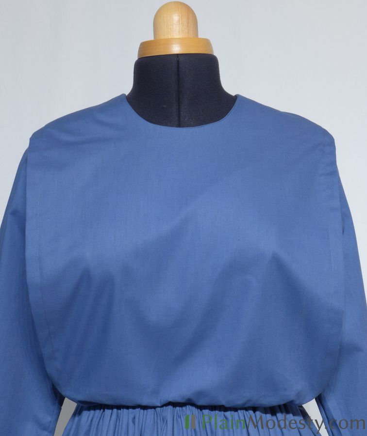 Cape Dress Front View Front view of a cape dress with a Narrow, Straight, Gathered, Gaping cape