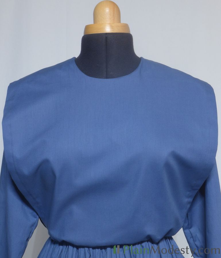 Cape Dress Front View Front view of a cape dress with a Wide, Straight, Loose cape