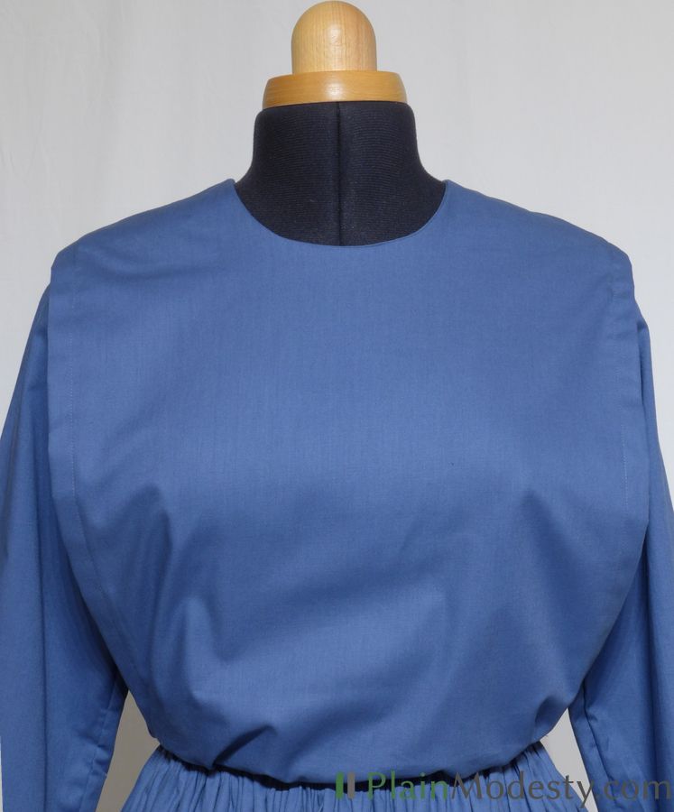 Cape Dress Front View Front view of a cape dress with a Narrow, Straight, Gathered, Loose, Tapered cape