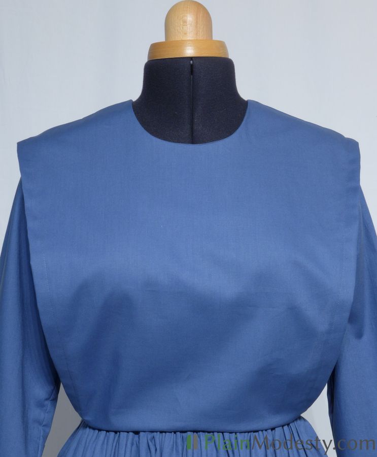 Cape Dress Front View Front view of a cape dress with a Wide, Slanted, Gaping cape