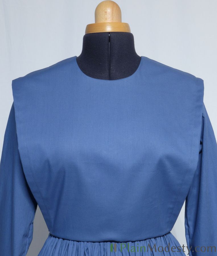 Cape Dress Front View Front view of a cape dress with a Wide, Slanted cape