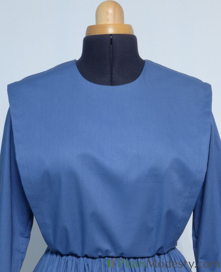 Cape Dress Front View Front view of a cape dress with a Wide, Slanted, Gathered cape