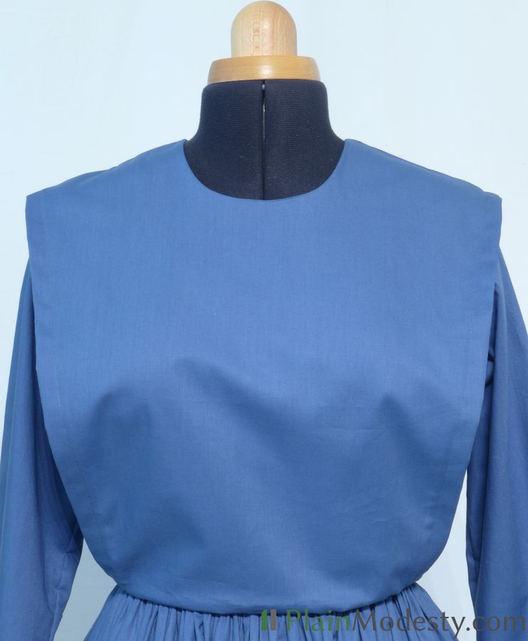 Cape Dress Front View Front view of a cape dress with a Wide, Slanted, Loose cape