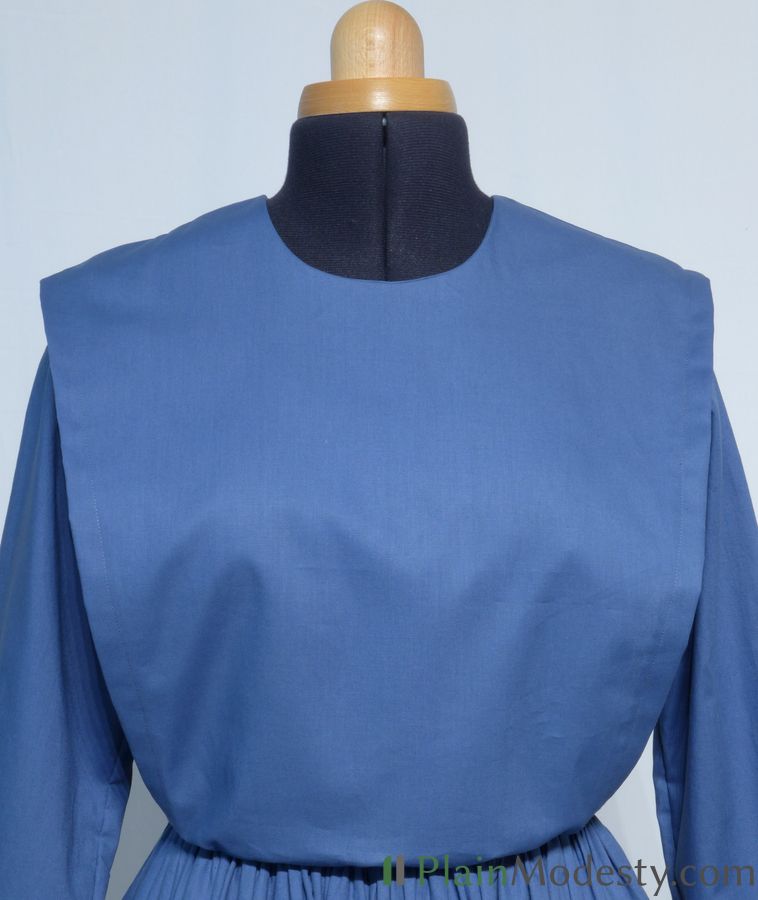 Cape Dress Front View Front view of a cape dress with a Wide, Slanted, Gathered, Loose cape