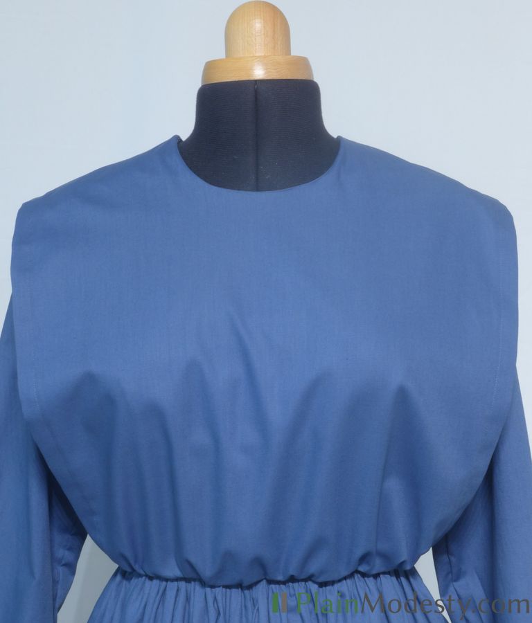 Cape Dress Front View Front view of a cape dress with a Wide, Straight, Gathered cape