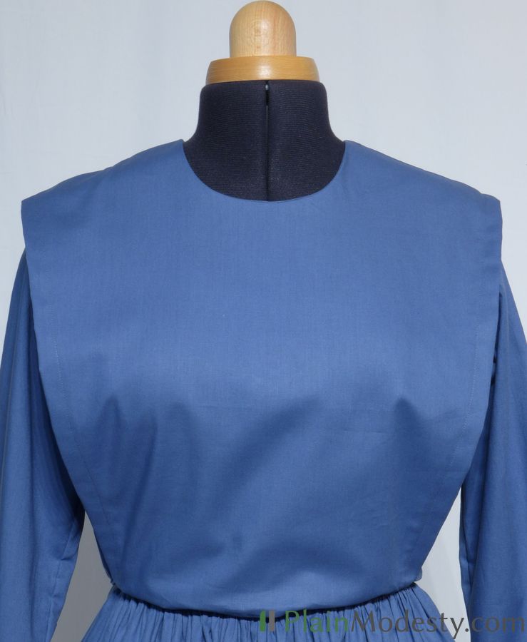 Cape Dress Front View Front view of a cape dress with a Wide, Slanted, Loose, Tapered cape