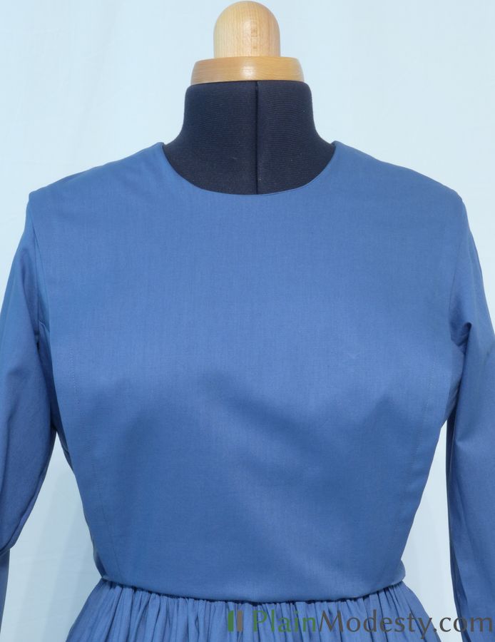 Cape Dress Front View Front view of a cape dress with a Narrow, Slanted cape