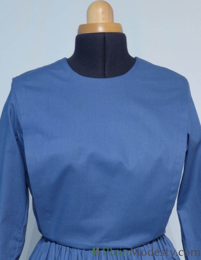 Cape Dress Front View Front view of a cape dress with a Narrow, Slanted, Loose cape