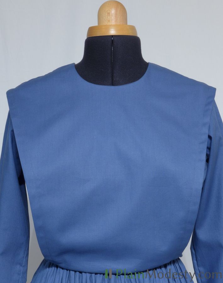 Cape Dress Front View Front view of a cape dress with a Wide, Slanted, Loose cape