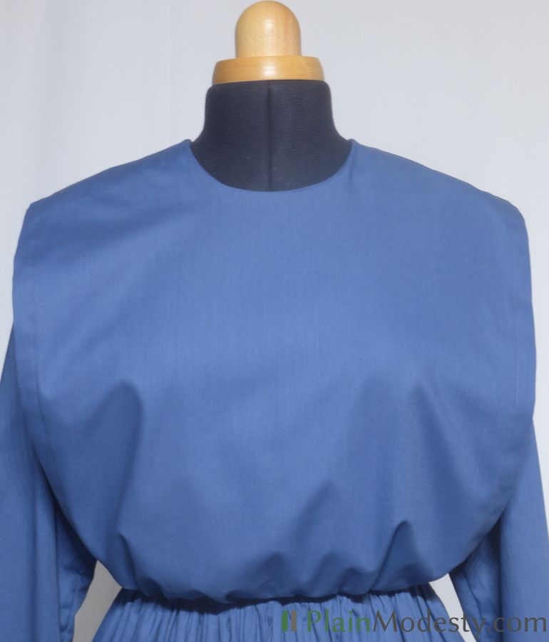 Cape Dress Front View Front view of a cape dress with a Wide, Straight, Loose, Gathered cape