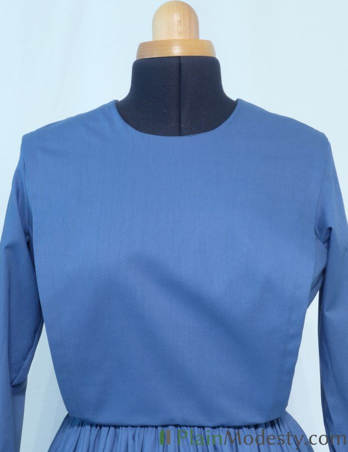 Cape Dress Front View Front view of a cape dress with a Narrow, Slanted, Gaping cape