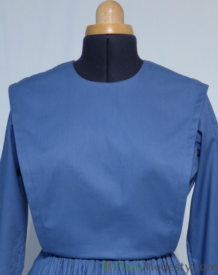 Cape Dress Front View Front view of a cape dress with a Wide, Slanted, Gaping cape