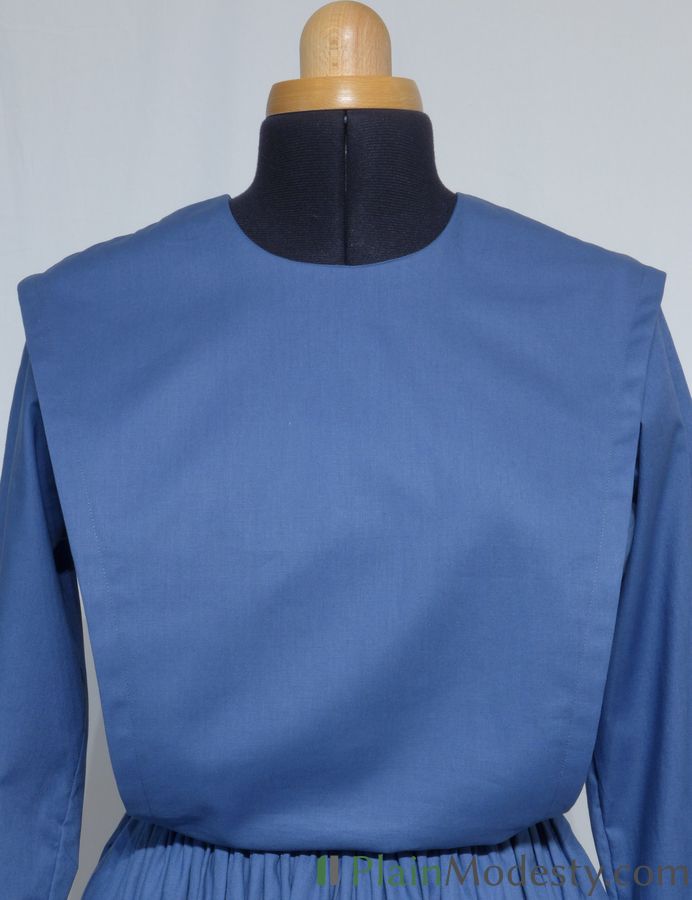 Cape Dress Front View Front view of a cape dress with a Wide, Slanted, Loose, Gaping cape