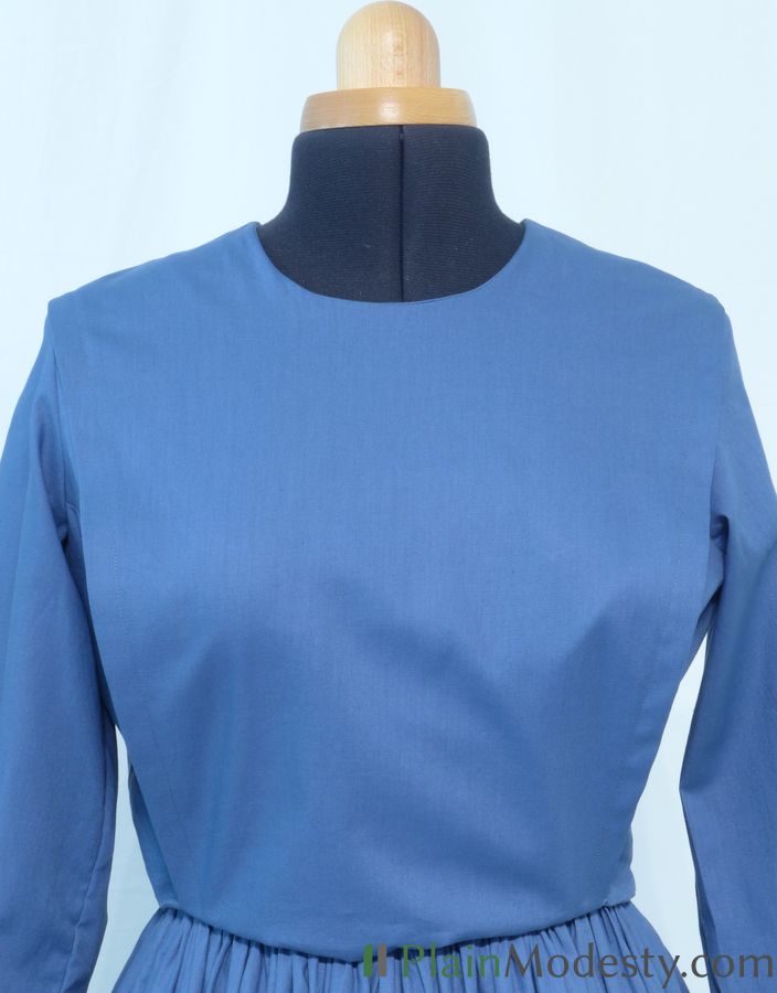 Cape Dress Front View Front view of a cape dress with a Narrow, Slanted, Loose, Tapered cape