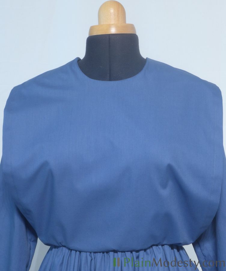 Cape Dress Front View Front view of a cape dress with a Wide, Straight, Gaping cape