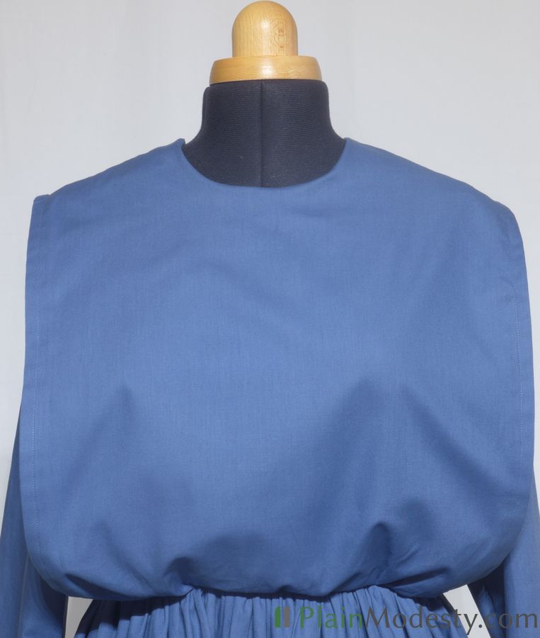 Cape Dress Front View Front view of a cape dress with a Wide, Straight, Loose, Gaping, Slightly Gathered cape