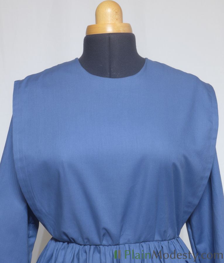 Cape Dress Front View Front view of a cape dress with a Wide, Straight, Gathered cape